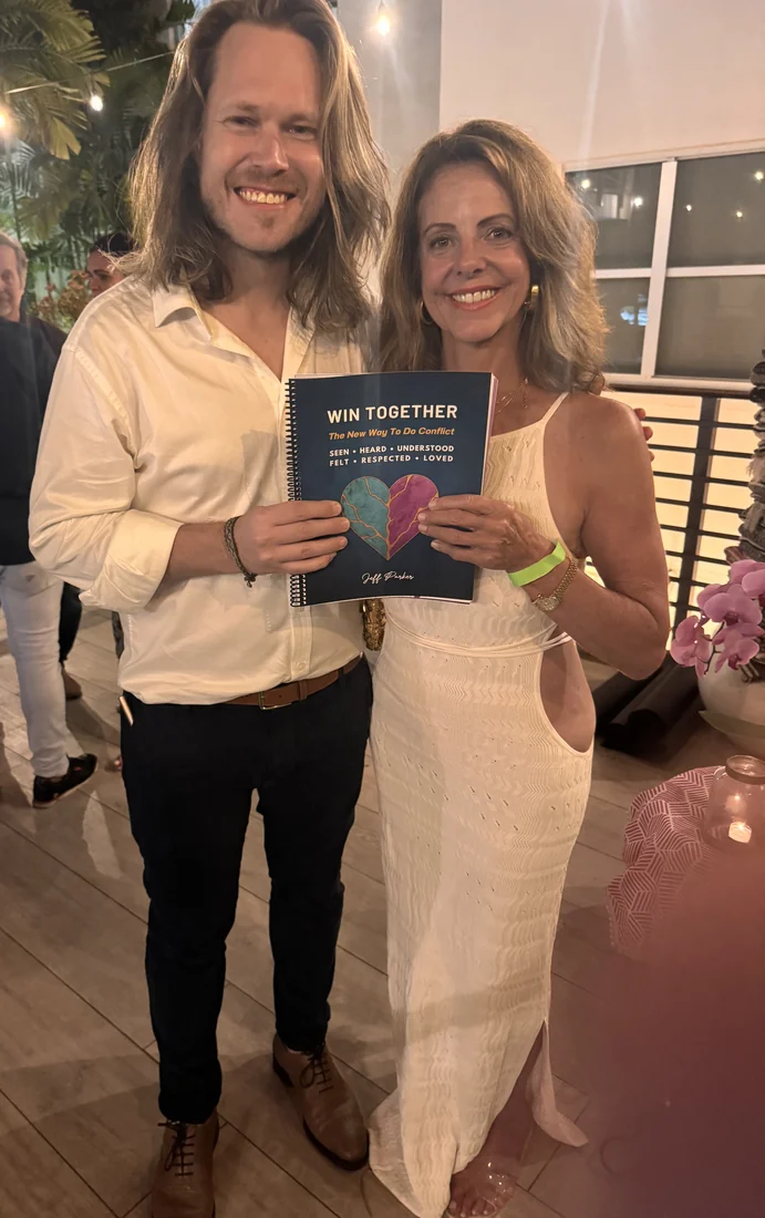 Jeff Parker Love with a reader, holding Win Together