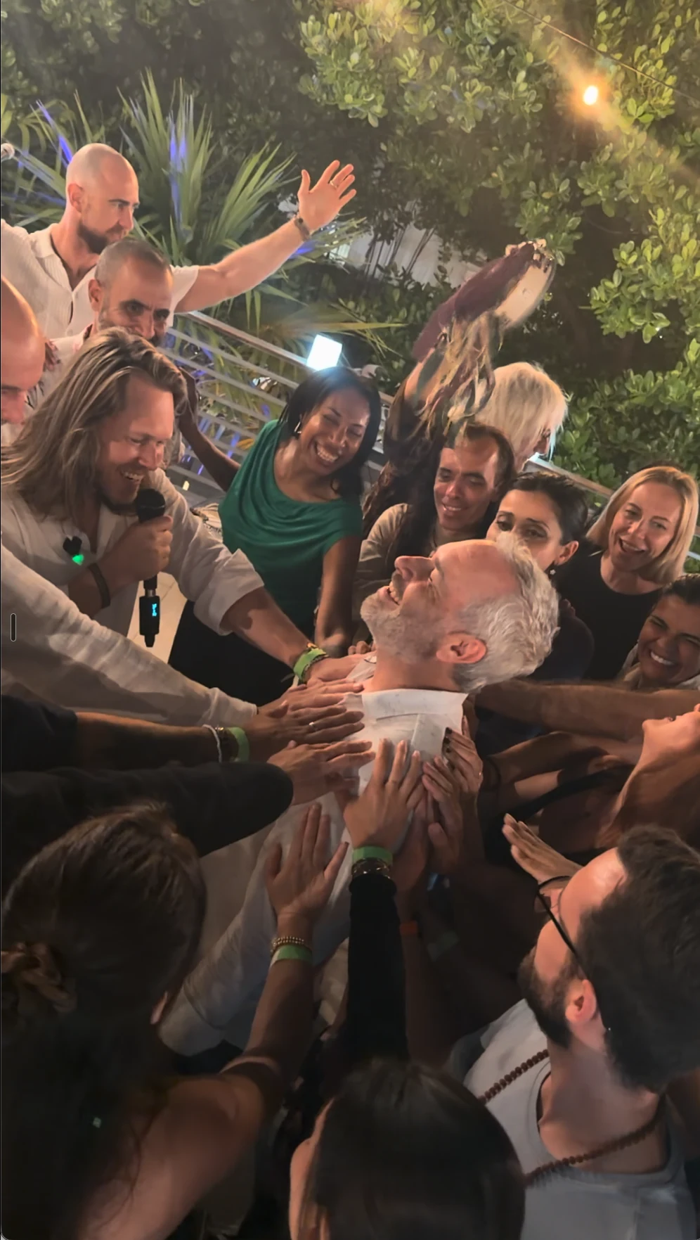 A room laying hands on one man