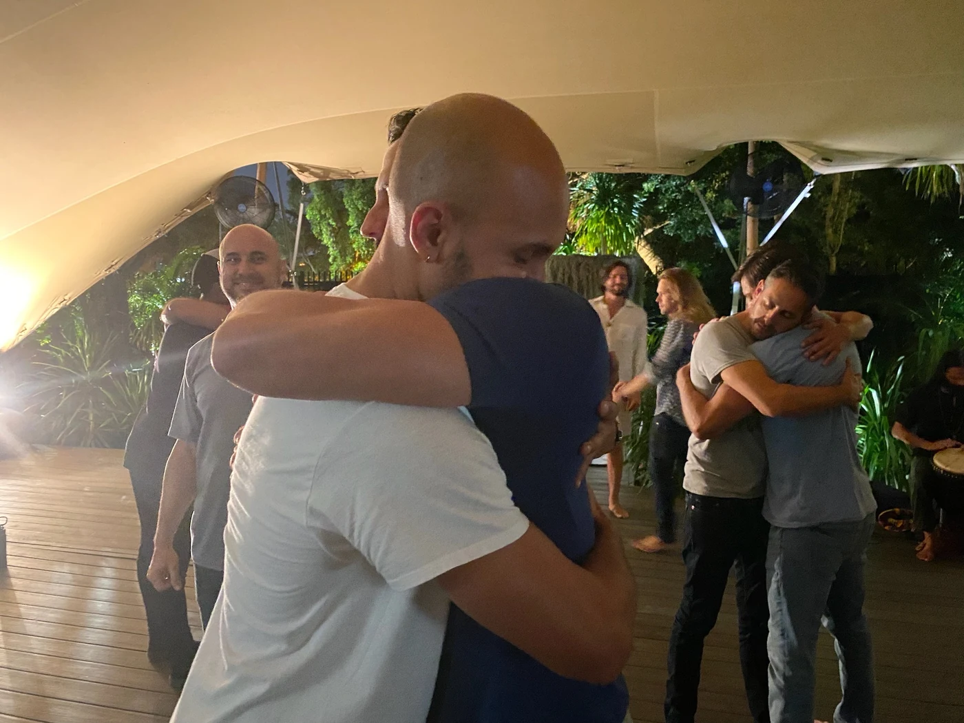 Two men embracing at a retreat