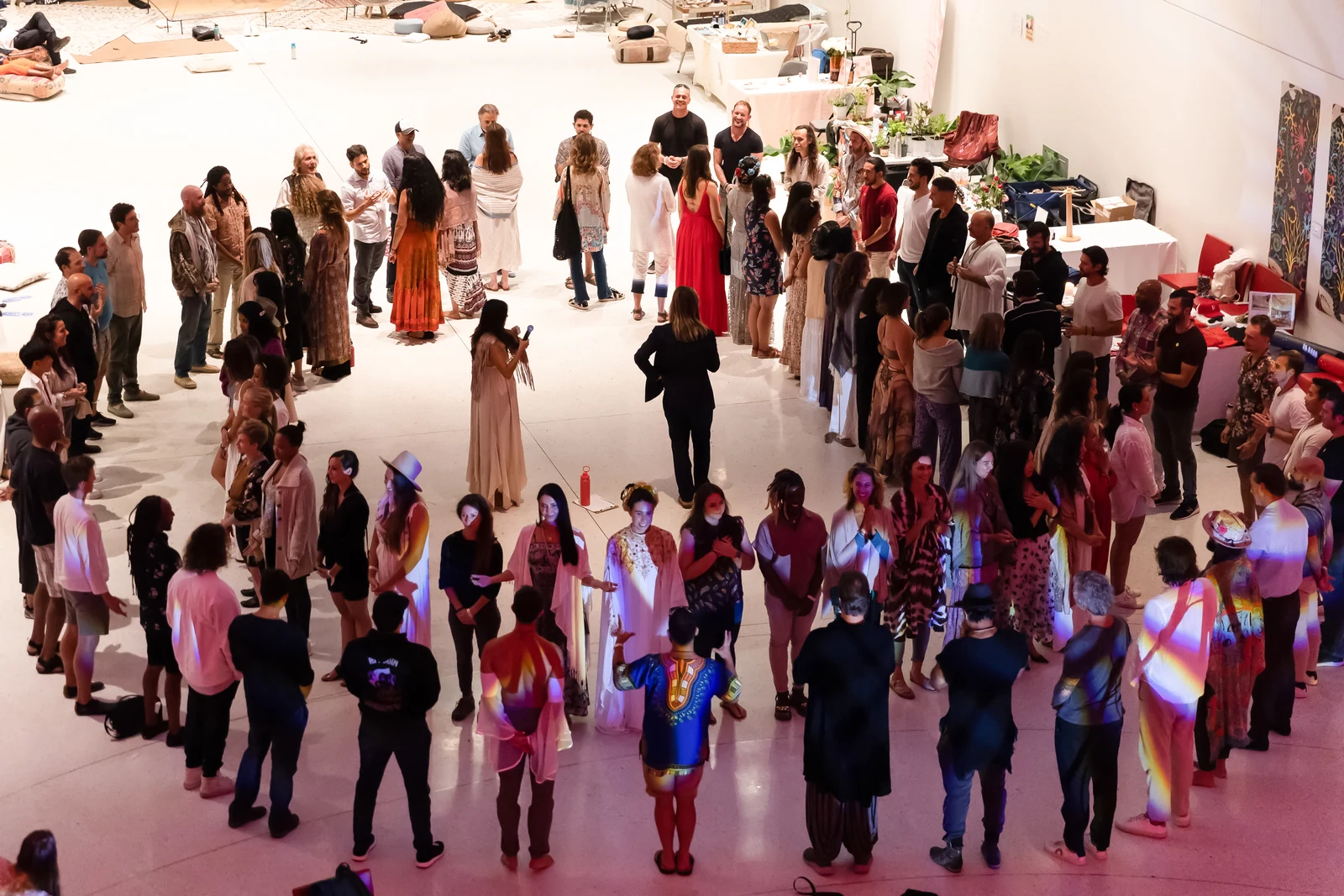 Two concentric circles of people facing each other at a Sacred Union workshop