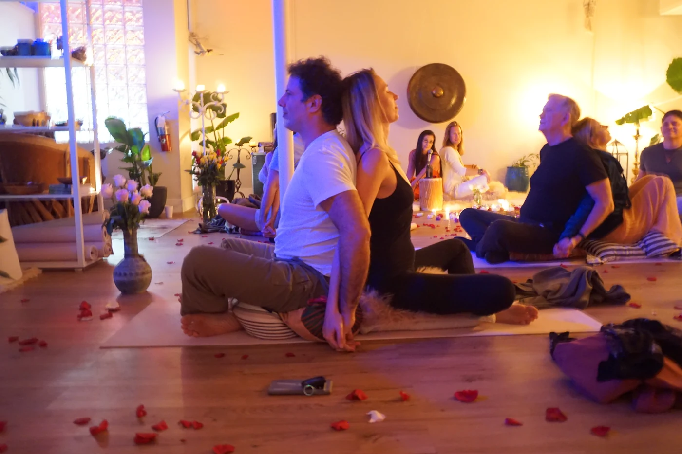 Couples working in pairs by candlelight