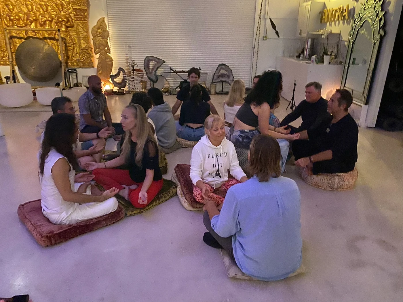 A circle of couples facing each other at a workshop